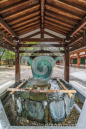 Hishaku dippers of Chozuya or Temizuya water ablution pavilion at Yakushi-Ji temple. Editorial Stock Photo