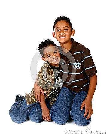 Hispanic Brothers Smiling and Hugging Stock Photo