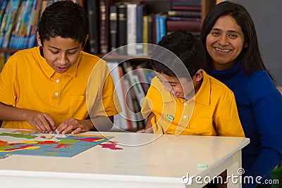 Hispanic Children Enjoying Time Fun Time with Mom Stock Photo