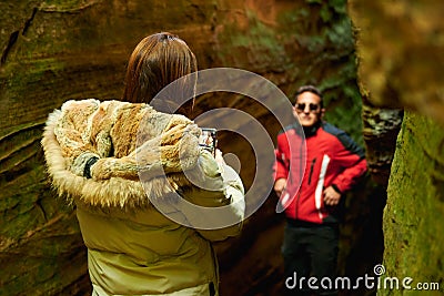 Hispanic couple taking pictures in Mullerhal national park in Luxembourg Stock Photo
