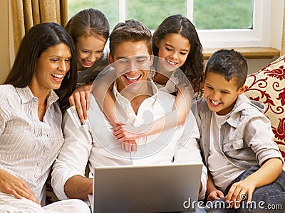 Hispanic family at home online shopping Stock Photo