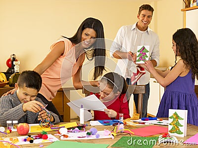 Hispanic family making Christmas cards Stock Photo