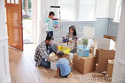 Hispanic Family Moving Into New Home Stock Photo