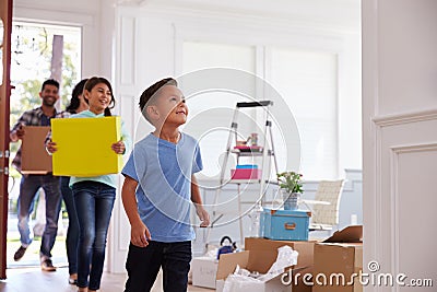 Hispanic Family Moving Into New Home Stock Photo