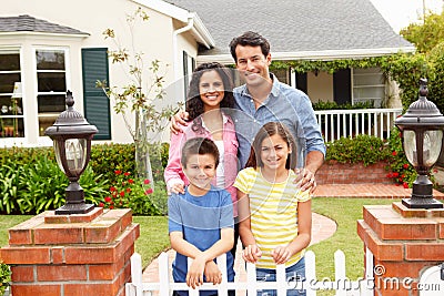 Hispanic family outside home Stock Photo