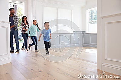 Hispanic Family Viewing Potential New Home Stock Photo