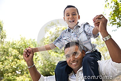 Hispanic Father and Son Having Fun in the Park Stock Photo