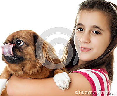 Hispanic girl carrying a small dog Stock Photo