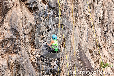 Hispanic Girl Climbing A Rock Wall Editorial Stock Photo