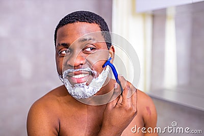 hispanic man put on foam on beard perfume lotion or skin care cream for sensitive skin Stock Photo