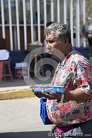 Hispanic man sells outside candy Editorial Stock Photo