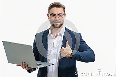 Hispanic man working on laptop in studio. Business man in suit checking email on laptop, writing message in social Stock Photo