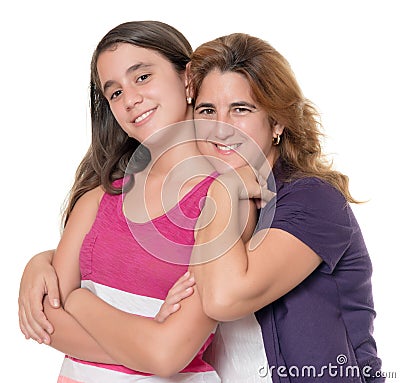 Hispanic mother hugs her teenage daughter isolated on white Stock Photo