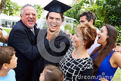 Hispanic Student And Family Celebrating Graduation Stock Photo