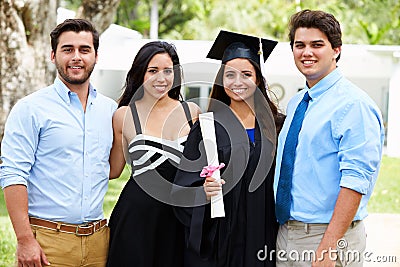 Hispanic Student And Family Celebrating Graduation Stock Photo