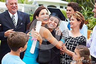 Hispanic Student And Family Celebrating Graduation Stock Photo