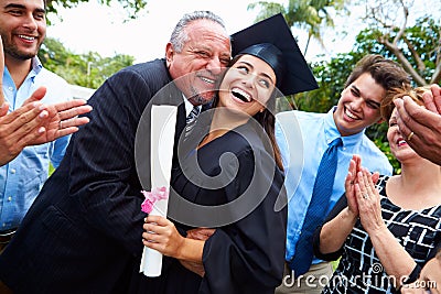 Hispanic Student And Family Celebrating Graduation Stock Photo