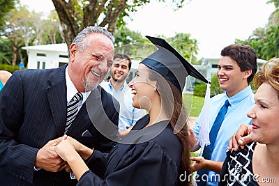 Hispanic Student And Family Celebrating Graduation Stock Photo