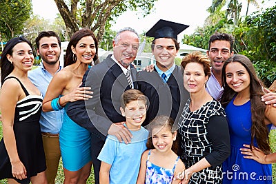 Hispanic Student And Family Celebrating Graduation Stock Photo