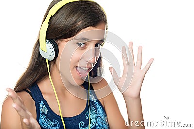 Hispanic teen listening to music with an excited expression Stock Photo