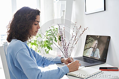 Hispanic teen school girl student distance learning online lesson on video call. Stock Photo