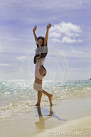 Hispanic woman in bikini at the beach Stock Photo