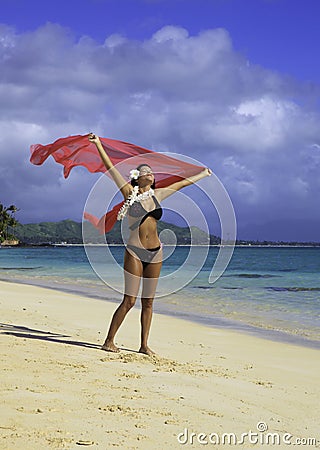 Hispanic woman in bikini at the beach Stock Photo