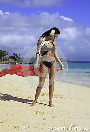 Hispanic woman in bikini at the beach Stock Photo