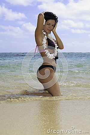 Hispanic woman in bikini at the beach Stock Photo