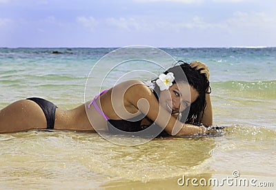 Hispanic woman in bikini at the beach Stock Photo