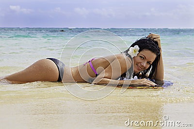 Hispanic woman in bikini at the beach Stock Photo