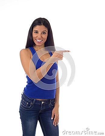 Hispanic woman in casual top and jeans smiling happy and cheerful pointing with finger presenting Stock Photo