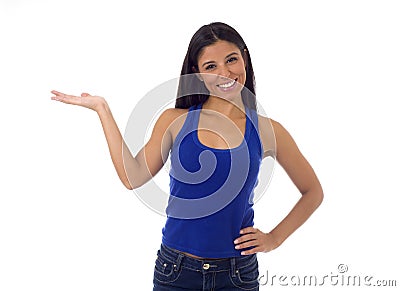 Hispanic woman in casual top and jeans smiling happy and cheerful presenting product Stock Photo