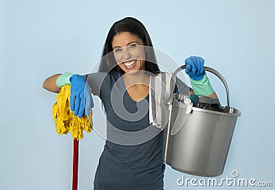 Hispanic woman happy proud as home or hotel maid cleaning and ho Stock Photo