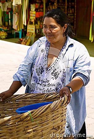 Hispanic woman sells outside Editorial Stock Photo