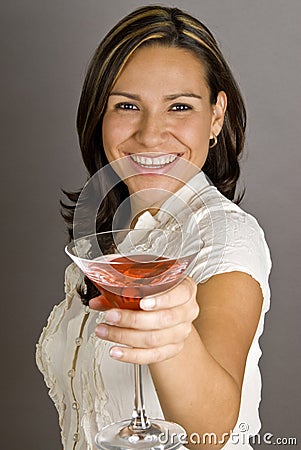 Hispanic Woman Toasting with a Martini Stock Photo