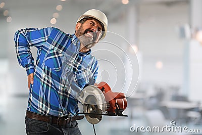 Hispanic Worker Suffering Back Injury Stock Photo