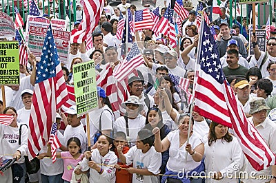 Hispanics wave American flags Editorial Stock Photo