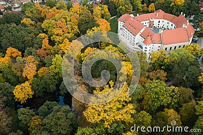 Historial Pezinok Castle surrounded by English park with rare trees in autumn colors, Slovakia Editorial Stock Photo