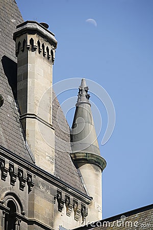Historic architecture of a building tower with spires on each corner and a chimney Stock Photo