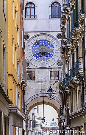 Historic astronomical zodiac clock tower and Piazza San Marco with the Doge's palace in the background in Venice, Italy Stock Photo