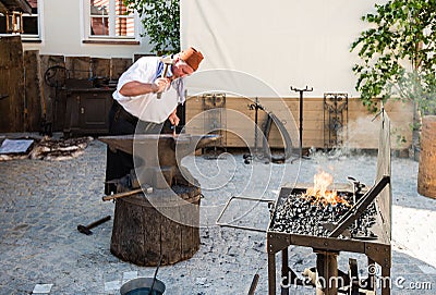 Historic Blacksmith At Work Editorial Stock Photo