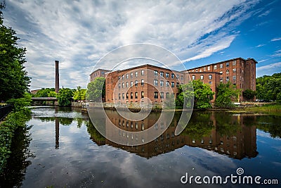 Historic brick buildings and the Cocheco River, in Dover, New Ha Stock Photo