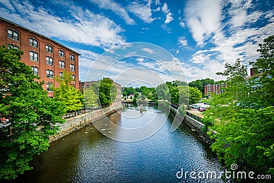 Historic brick buildings and the Cocheco River, in Dover, New Ha Stock Photo