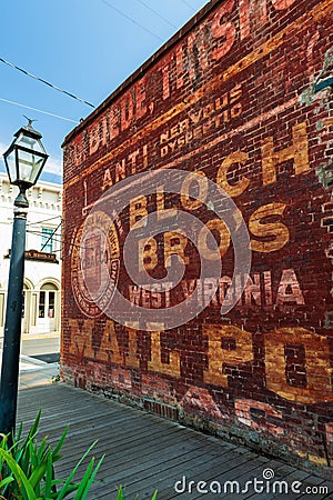 historic brick business billboards Editorial Stock Photo