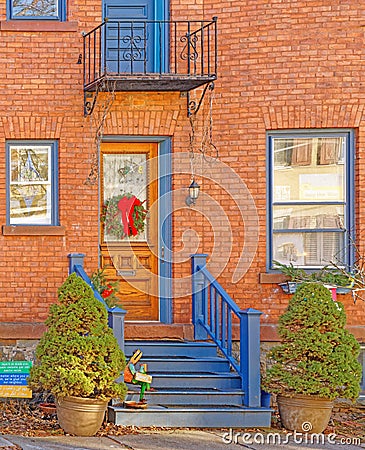 historic brown brick building in Stockade Historic District decorated for Christmas Stock Photo