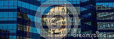 Historic building mirrored in office high rise Stock Photo