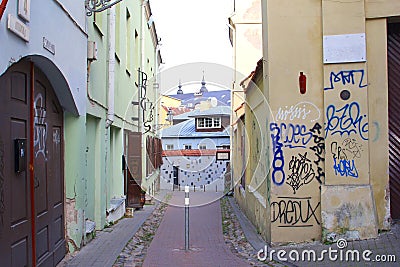 Historic buildings and graffiti in Literatu street, Vilnius, Lithuania Editorial Stock Photo