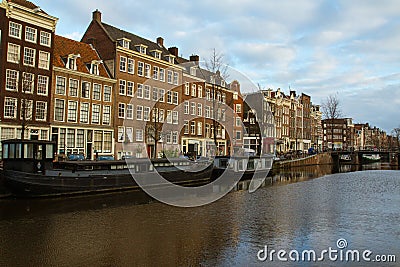 Historic buildings over the canals in the Old Town of Amsterdam. Netherlands Editorial Stock Photo