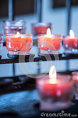 Historic catholic church: Close up picture of candles Stock Photo